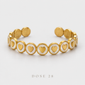 Gold-Tone Heart Medallion Cuff   أسوارة القلوب باللون الذهبي والأبيض اللؤلؤي