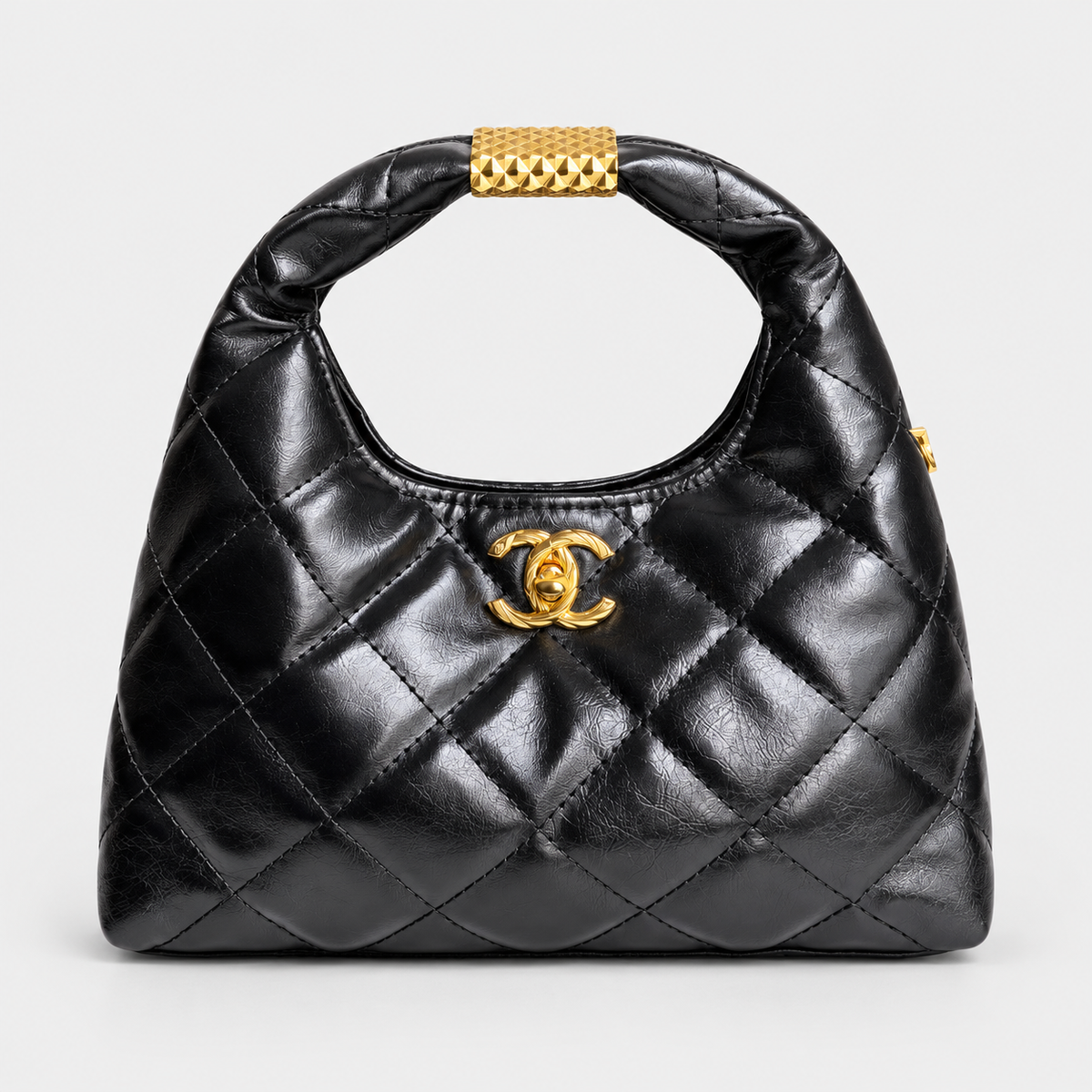 Chanel Quilted Black Hobo-Style Bag with Gold-Tone Handle Accent حقيبة شانيل سوداء مبطنة بنمط هوبو مع زينة ذهبية على المقبض