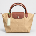 Longchamp Le Pliage Original Handbag — Beige with Brown Handles  حقيبة لونشان لو بلياج أوريجينال باللون البيج مع مقابض بنية