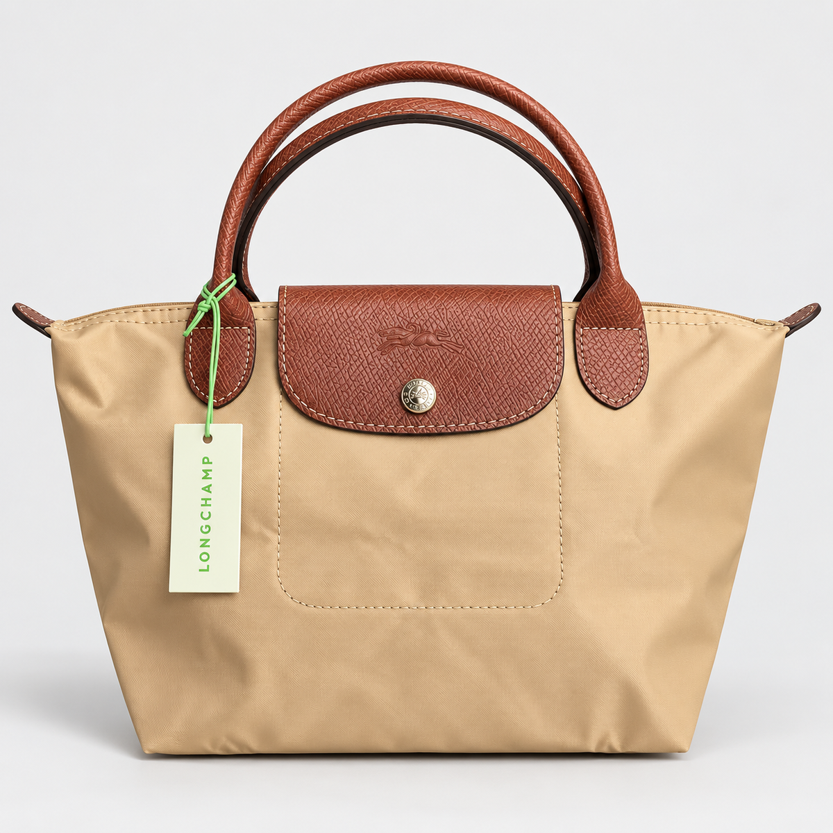 Longchamp Le Pliage Original Handbag — Beige with Brown Handles  حقيبة لونشان لو بلياج أوريجينال باللون البيج مع مقابض بنية