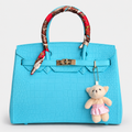 جنطة بتصميم بيركن ونقشة تمساح – تركواز Hermès Birkin -Style Croc-Effect Handbag – Turquoise with Teddy Char