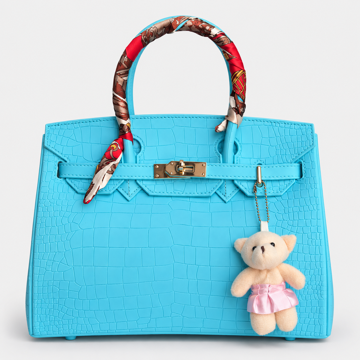 جنطة بتصميم بيركن ونقشة تمساح – تركواز Hermès Birkin -Style Croc-Effect Handbag – Turquoise with Teddy Char