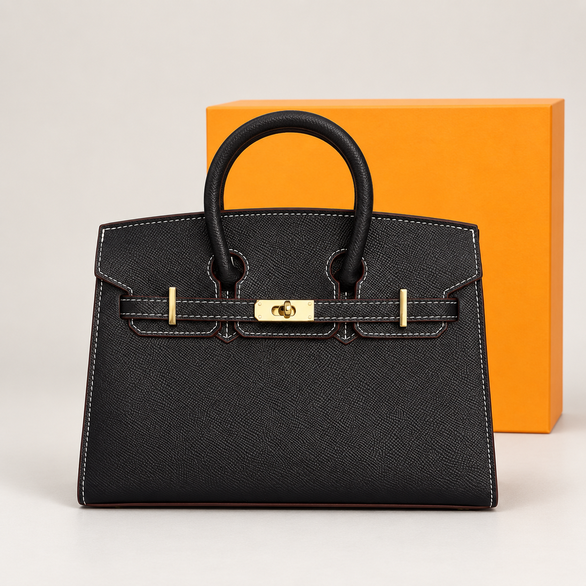 جنطة يد سوداء بنقشة التمساح وتفاصيل ذهبية Hermes Black Croc-Embossed Top Handle Bag