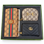 طقم محافظ غوتشي أسود وتان — ٣ قطع
Gucci Black & Tan Wallet Set — 3 Pieces