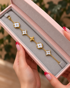 Gold-Tone Bracelet with Pearly White Floral Motifs سوار بلون ذهبي بزخارف زهرية بيضاء لؤلؤية