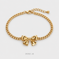 Gold-Tone Bow Bracelet سوار الفيونكة الذهبي
